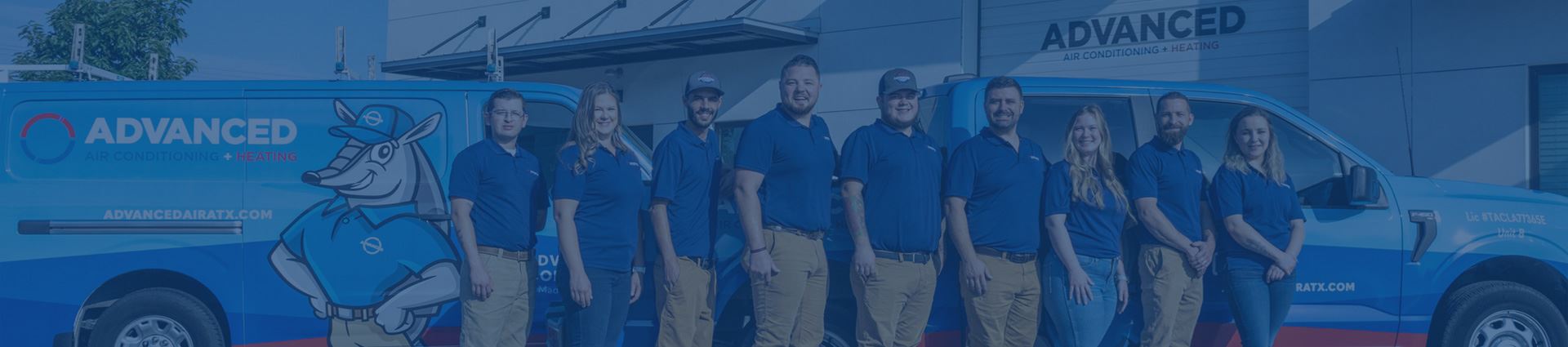 The full team at Advanced Air Conditioning + Heating standing in front of the company's branded blue van outside their Cedar Park, Texas shop